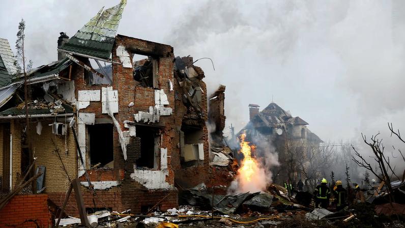 Firefighters work at the site of a residential building damaged during Russian drone and missile strikes, amid Russia's attack on Ukraine, in Kyiv, Ukraine, February 22, 2026.