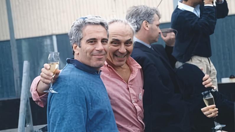 Jeffrey Epstein with a man who appears to be Les Wexner, center, and a person whose face has been redacted at a social gathering in this undated image. The image appeared in the page after Wexner's handwritten note in a 2003 book celebrating Epstein's 50th birthday.