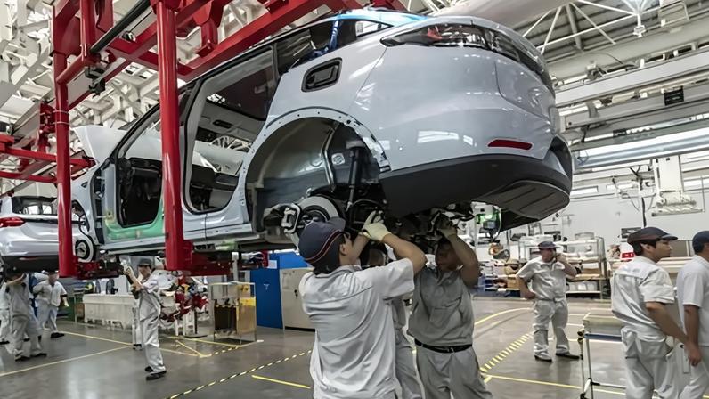The assembly line at an electric car production facility in China, a sector that contributed to a record 15.4tn yuan ($2.1tn) of business last year.