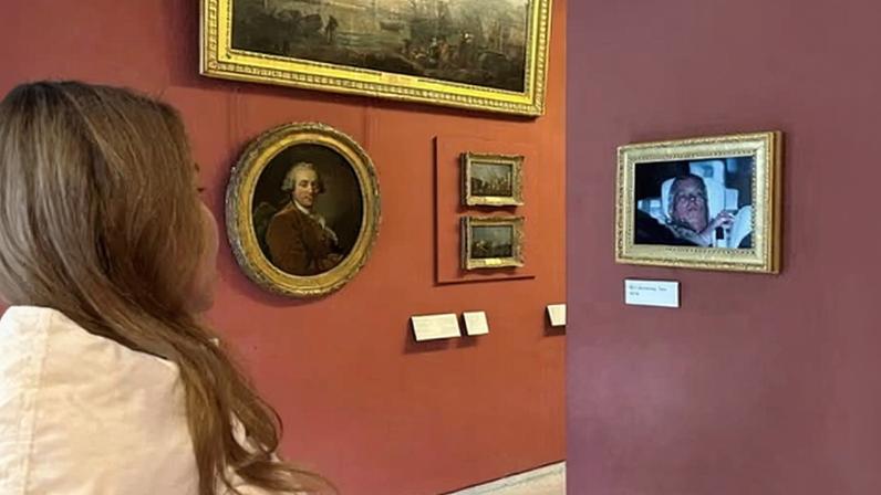 The British political campaign group Everyone Hates Elon fixed the photo to a wall in the Louvre gallery in Paris on Sunday.