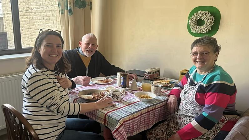 Alison Taylor and her parents during their final breakfast before moving out.