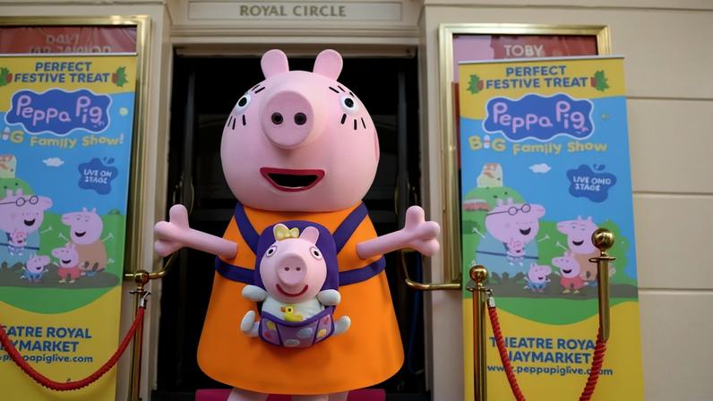 Mummy Pig and Evie Pig pose for photos in London in December.