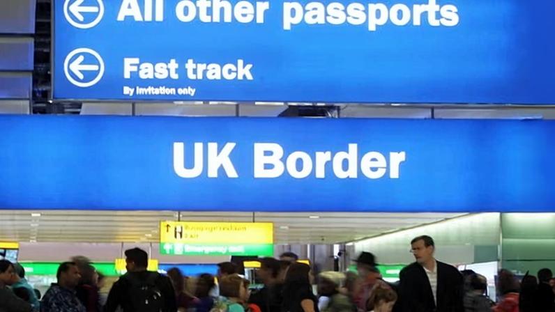 Passengers going through UK border control at Heathrow airport. The new rules come into force on 25 February.