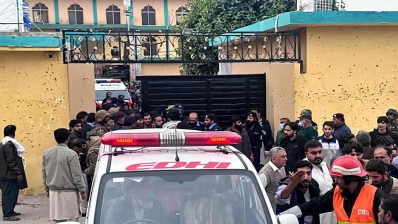 Emergency services take people injured in the explosion at the Khadija al-Kubra mosque to hospital.