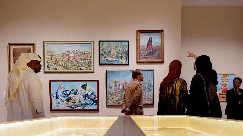 Visitors at the Beginnings of Saudi Art Movement exhibition