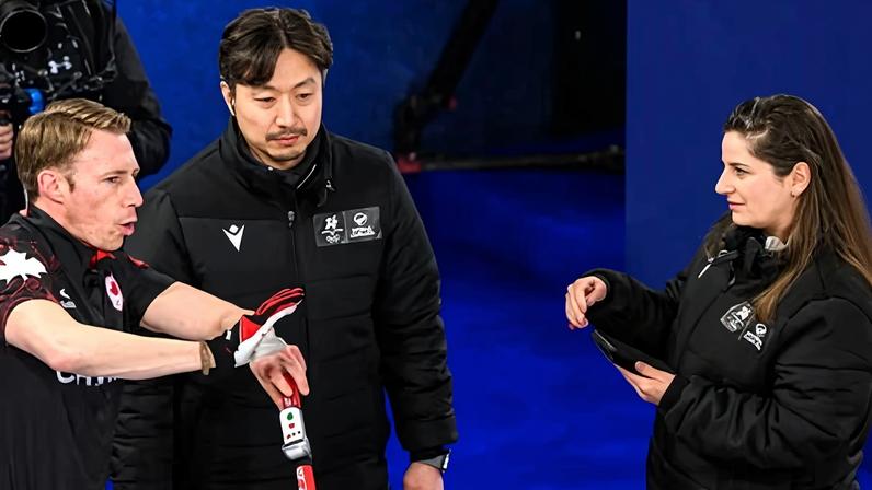 Marc Kennedy of Canada debates with the referees during his team’s win over Sweden.