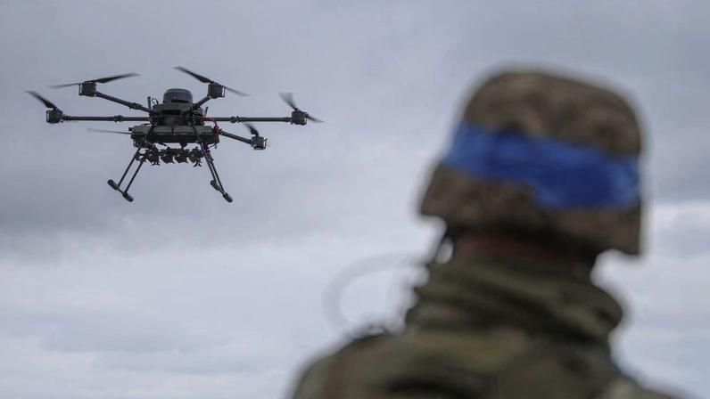 A Ukrainian serviceman of the 25th Airborne Brigade looks at a Vampire, a heavy unmanned aerial vehicle, during its flight near a front line, amid Russia's attack on Ukraine, in Donetsk region, Ukraine April 5, 2025.
