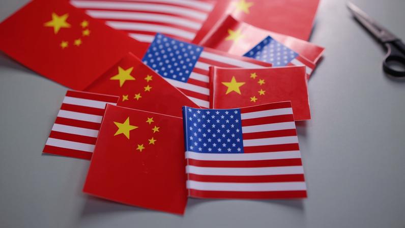 U.S. and Chinese flags are seen in this illustration taken March 20, 2025. REUTERS/Dado Ruvic/Illustration