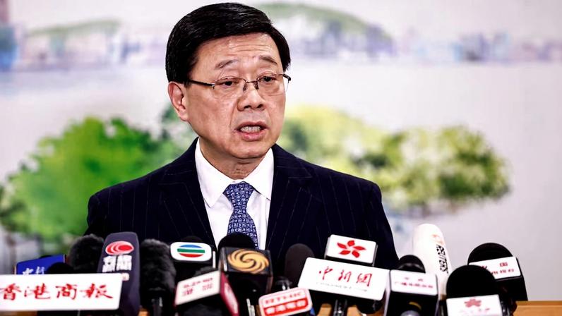 Chief Executive of Hong Kong John Lee speaks during a press conference in Beijing