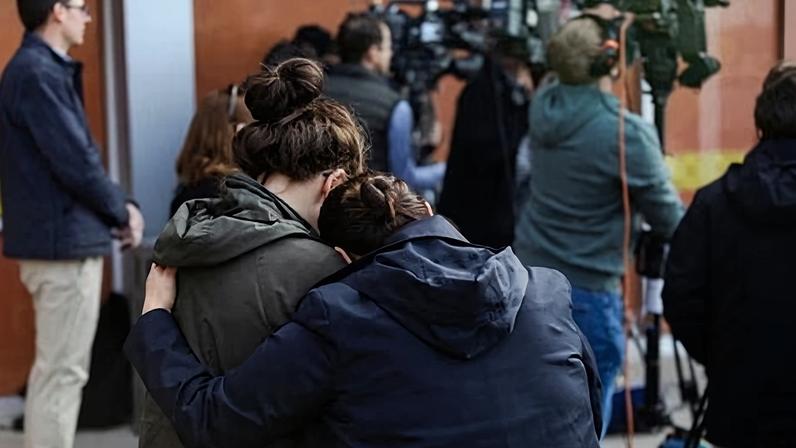 Parents outside the Rayito De Sol daycare in Chicago, where immigration agents conducted a raid and detained a teacher on 5 November 2025.