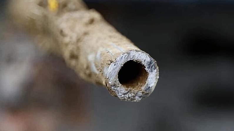 A lead pipe is shown after being replaced by a copper water supply line to a home in Flint, Michigan, on 20 July 2018.