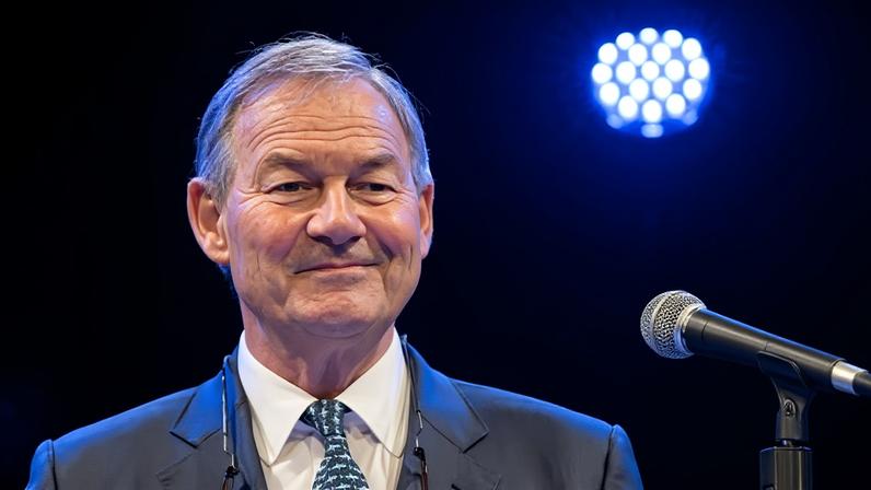 Rupert Lowe speaking at a lectern