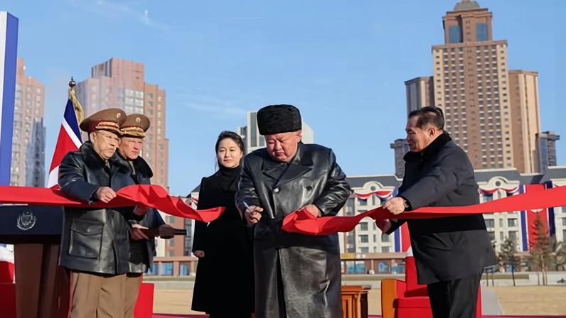 North Korean leader Kim Jong-un (C) and his daughter Kim Ju-ae (centre L) attend the opening ceremony of a new housing precinct in Pyongyang for families of soldiers killed while fighting for Russia in the Ukraine war.