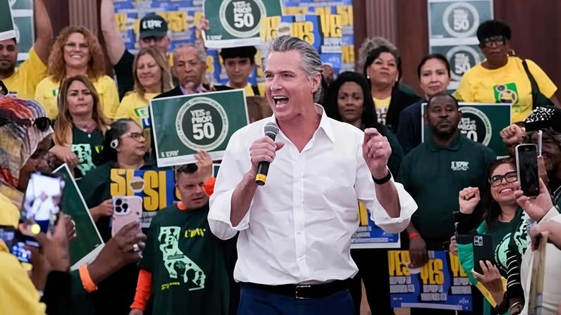 Gavin Newsom speaking with supporters during a Get Out the Vote kick-off rally in November 2025.