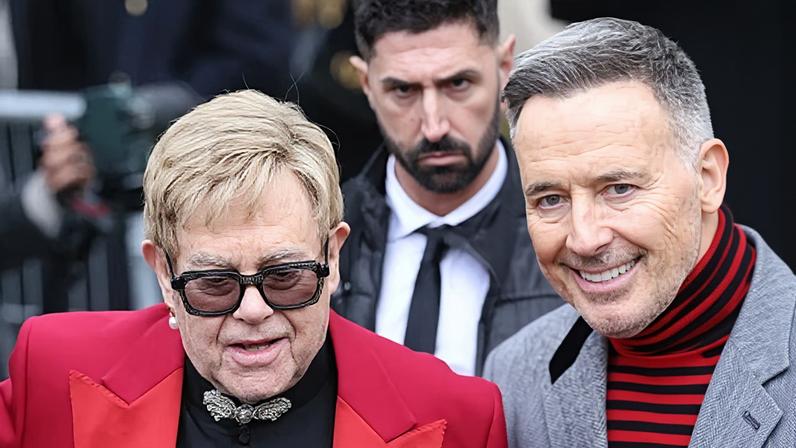 John and his husband, David Furnish, at Paris fashion week last month.