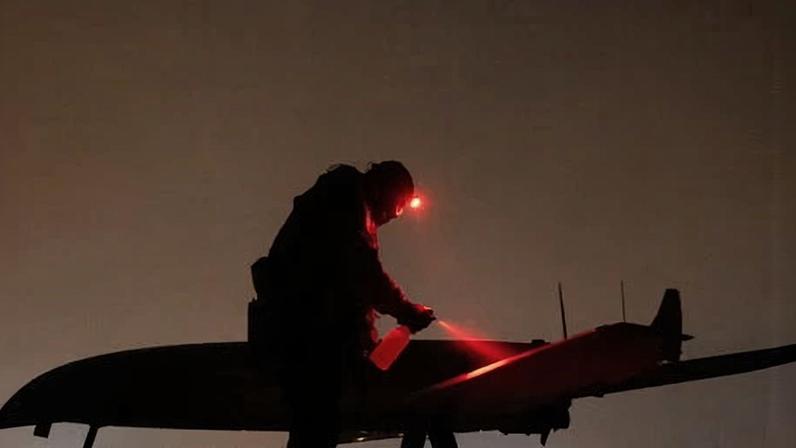 Ukrainian service member prepares a deep strike drone before its launch toward Russian territory