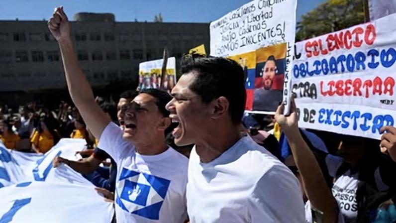 People take part in a rally to call for the release of political prisoners in Caracas, Venezuela.