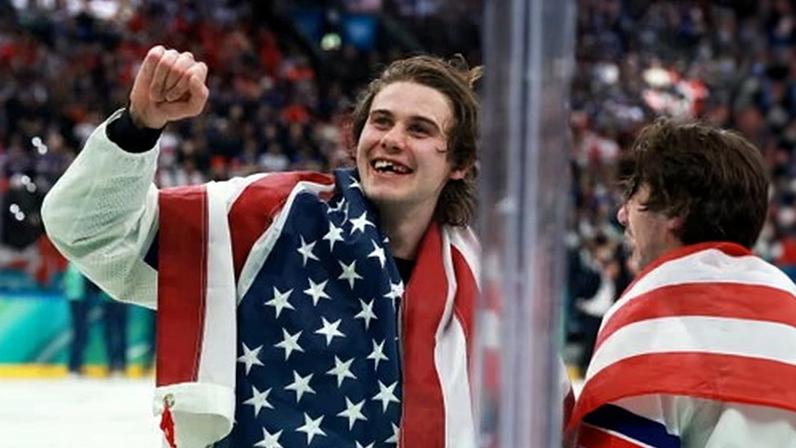 Jack Hughes celebrates after securing gold for the US against Canada.