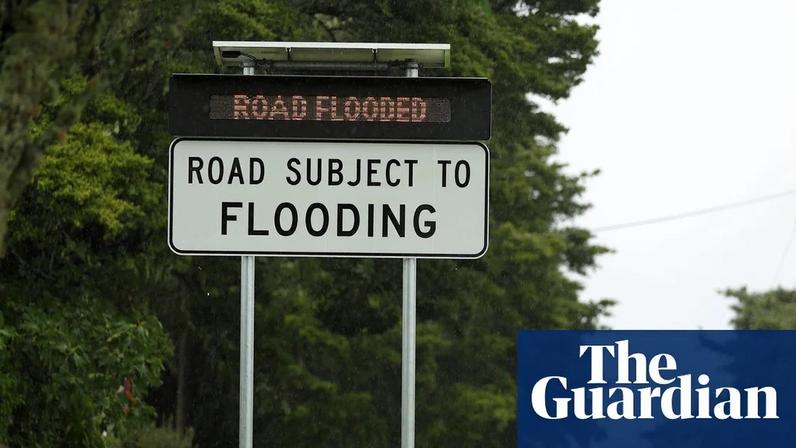File photo: A sign warns motorists on a flooded road in near Auckland, New Zealand.