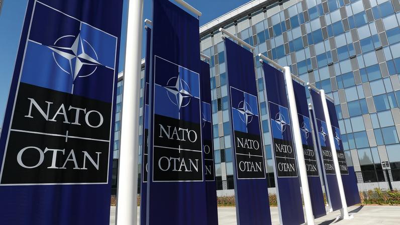 Banners displaying the NATO logo are placed at the entrance of new NATO headquarters during the move to the new building, in Brussels, Belgium April 19, 2018. REUTERS/Yves Herman