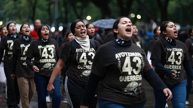 Demonstrators take part in a rally to demand justice for the 43 missing students from Ayotzinapa, in Mexico City on 26 September 2025.