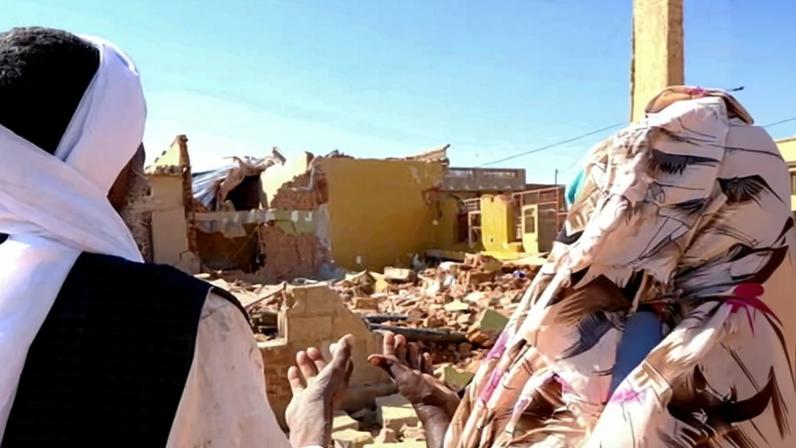 People pray in front of a house hit by a drone in El Obeid, North Kordofan state, earlier in January. The UN said the RSF also hit an aid convoy in the state on Friday.
