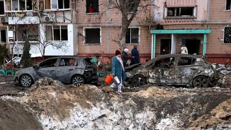 A crater left by a Russian strike outside a block of flats in Zaporizhzhia, Ukraine.