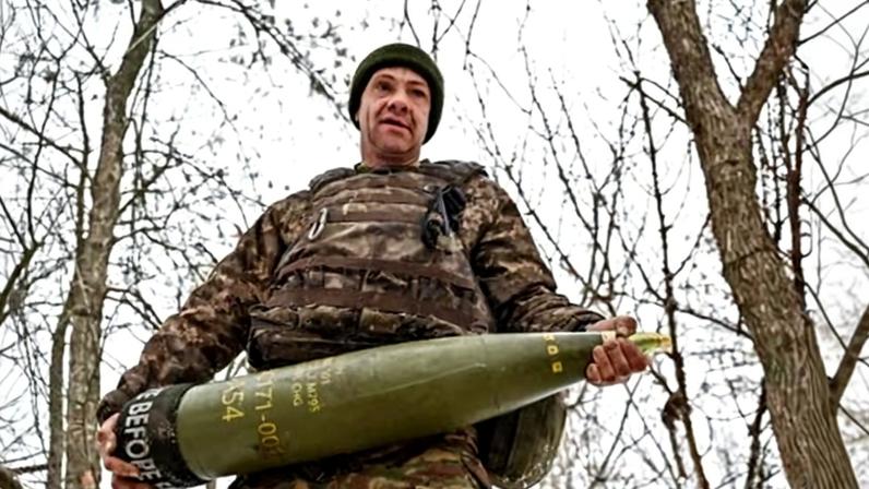 A Ukrainian soldier near a frontline in the Zaporizhzhia region carries a 155mm artillery shell. One defence analyst described the munition as the ‘bedrock of all armies when they go into war’.
