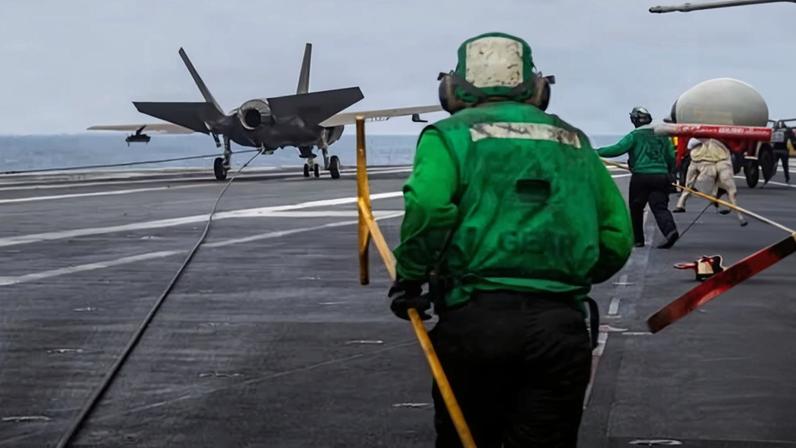 A US navy handout photo shows a F-35C fighter jet landing on the flight deck of USS Abraham Lincoln in the Arabian Sea last week.