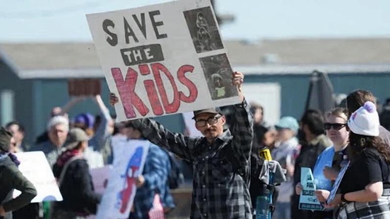Protesters gather outside the detention facility where Liam Ramos and his father are being detained in Dilley, Texas, on 28 January.