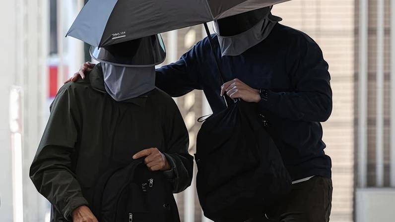 Kwok Yin-sang, father of wanted US-based activist Anna Kwok, arrives at court in Hong Kong on 11 February.