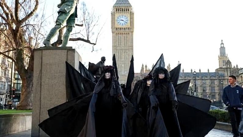 Extinction Rebellion protesters stage a protest near the Elizabeth Tower, commonly referred to as Big Ben, in London on 20 December.