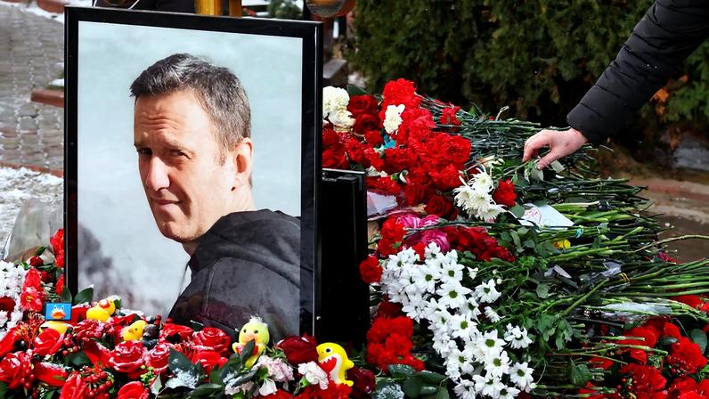 People mark first anniversary of Russian opposition leader Navalny's death at Moscow cemetery