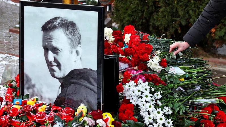 People mark first anniversary of Russian opposition leader Navalny's death at Moscow cemetery