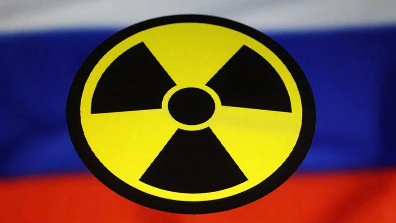 A Russian flag and a nuclear sign are seen in this illustration taken March 13, 2024. REUTERS/Dado Ruvic/Illustration