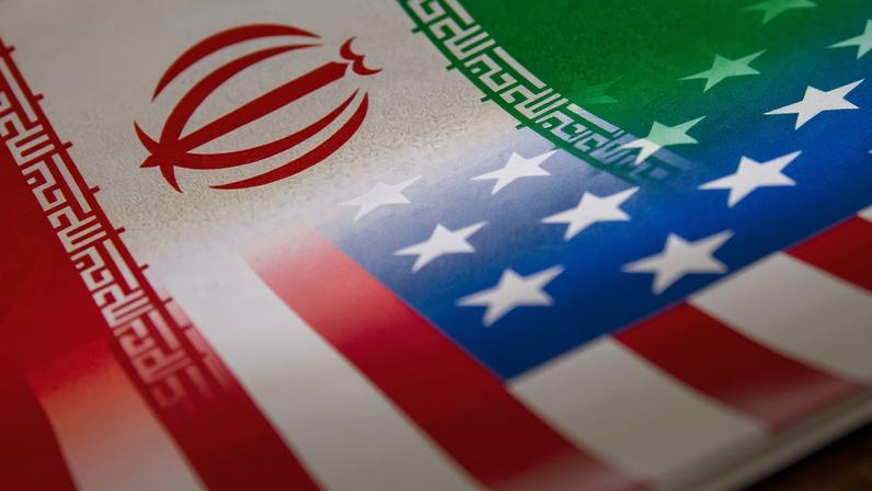 Iran's and U.S.' flags are seen printed on paper in this illustration taken January 27, 2022. REUTERS/Dado Ruvic/Illustration
