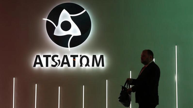 A participant walks past an exhibition stand of Russia's State Atomic Energy Corporation Rosatom at the Russian Energy Week international forum in Moscow, Russia, October 15, 2025.