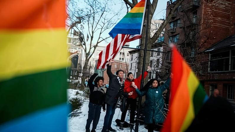 People gather near Stonewall after authorities removed the Pride flag in New York.