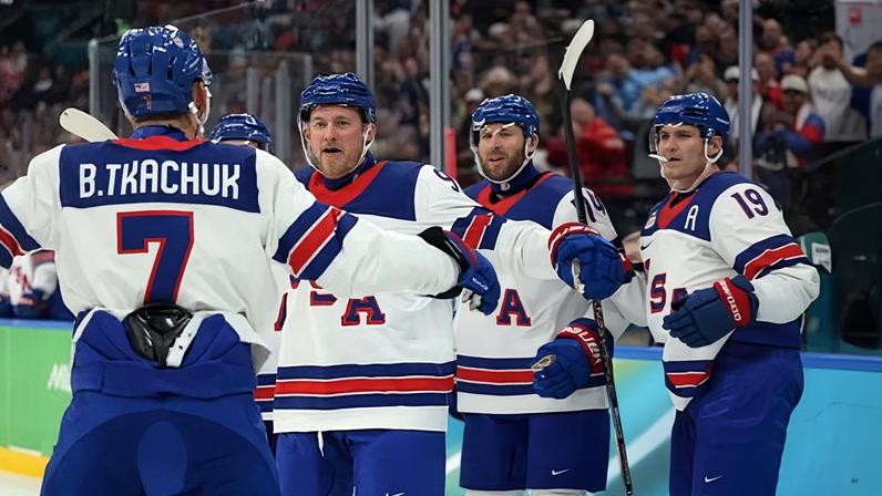 Jack Eichel of the United States celebrates with teammates after scoring a goal in the second period during Friday’s Olympic semi-final win over Finland in Milan.