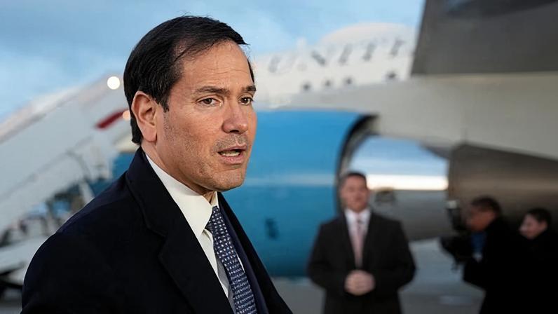US secretary of state Marco Rubio speaks to reporters before boarding his plane to the Munich Security Conference in Germany on Thursday. Follow the latest updates, live.