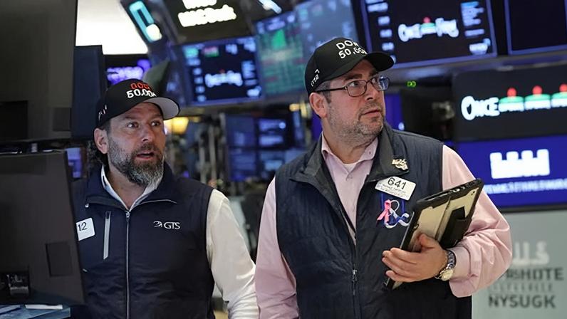 Traders react as the Dow Jones Industrial Average surpasses the 50,000 mark, at the New York Stock Exchange in New York City, on 6 February.