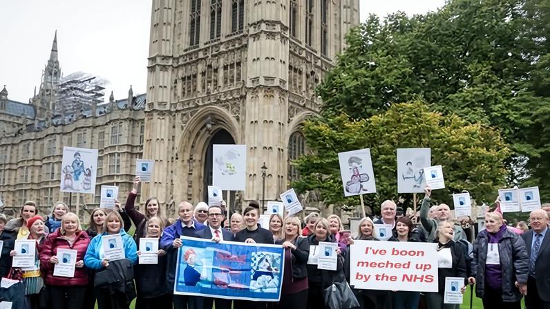 Campaigners protesting outside parliament in 2017 over the failures of the medical procedure.