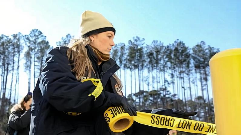 An FBI employee places crime scene tape outside the Fulton county election center in Union City, Georgia, last week.