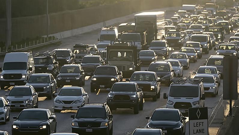 The morning commute on northbound Interstate 405 at sunrise in Los Angeles, California.