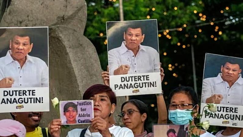 Members of the Catholic Church stand in solidarity with relatives of victims of former Philippine president Duterte's drug war in Manila, days before his pre-trial hearing at the ICC begins.