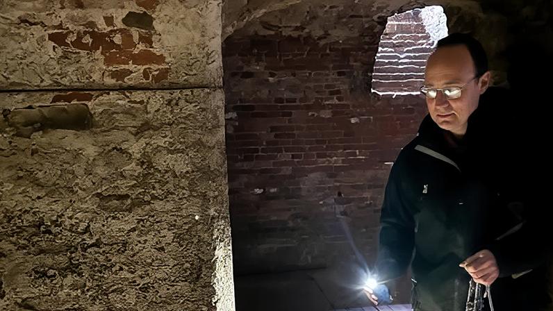 National Trust ranger Nick Dunnett patrols the cellar at Tattershall Castle to check for newts
