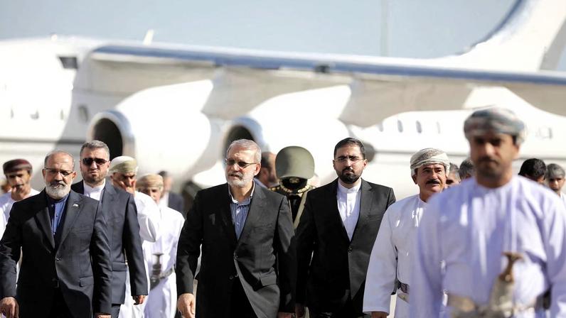 Secretary of the National Security Council, Ali Larijani is welcomed by the Minister of the Royal Office in the Sultanate of Oman, Sultan bin Mohammed al Numani, upon his arrival in Muscat, Oman, February 10, 2026. Iran's National Security Council/WANA (West Asia News Agency)/Handout via REUTERS