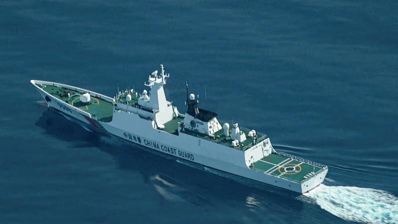 An aerial view of a China Coast Guard ship navigating near the disputed Scarborough Shoal, as Philippine Coast Guard aircraft carrying journalists patrols the area