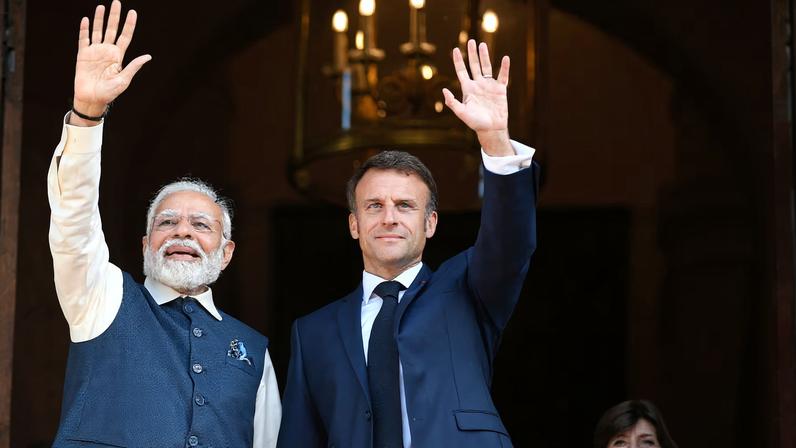 France's President Emmanuel Macron and India's Prime Minister Narendra Modi wave to the press prior to attending a meeting at The Ministry of Foreign Affairs in Paris, France on July 14, 2023.