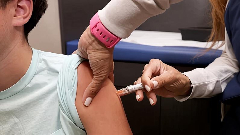 A child receives a standard immunization on 15 September 2025 in Coral Gables, Florida.